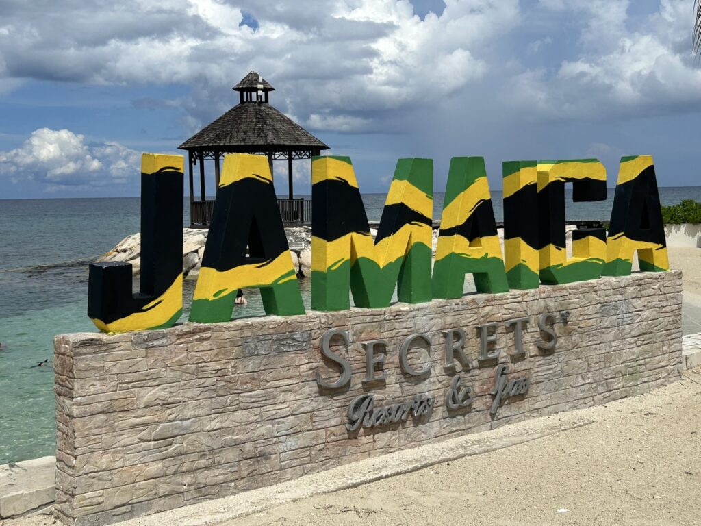 Jamaica sign with Secrets on it