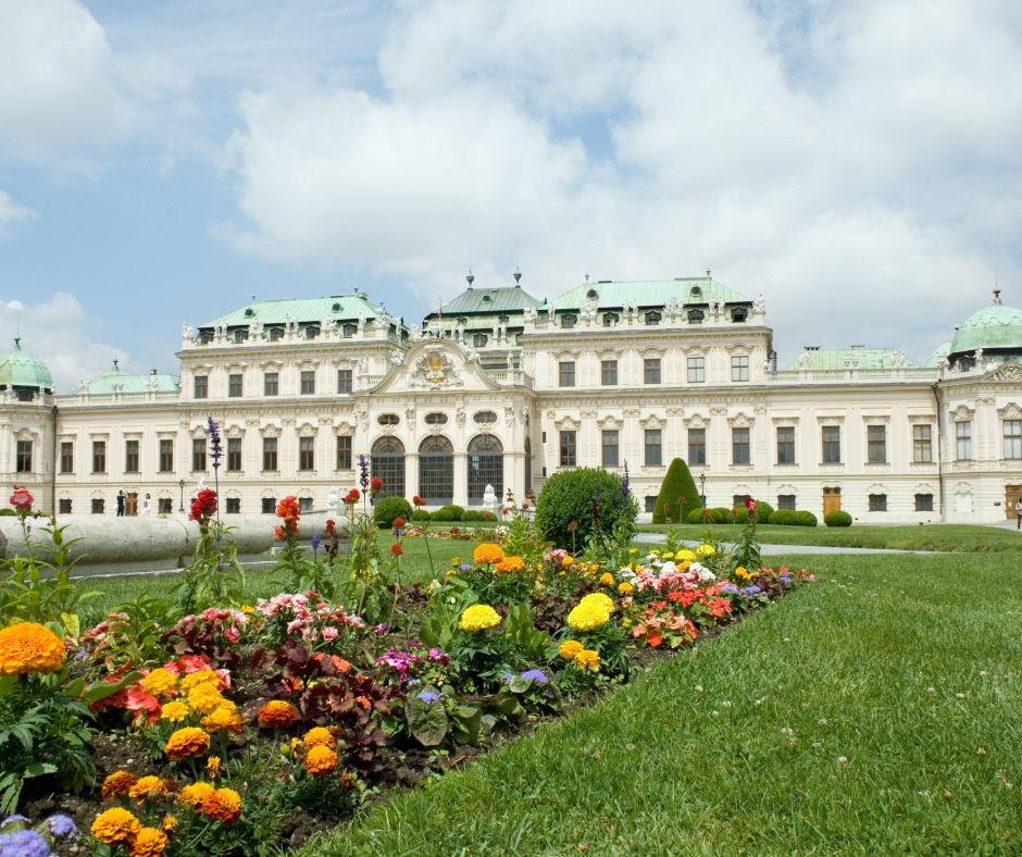 The lawn of Belvedere Palace with colorful flowers.