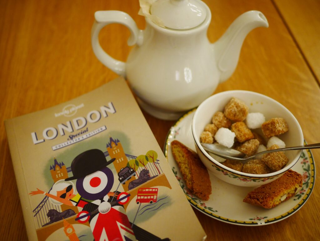 Book of London with Tea and desserts on a table