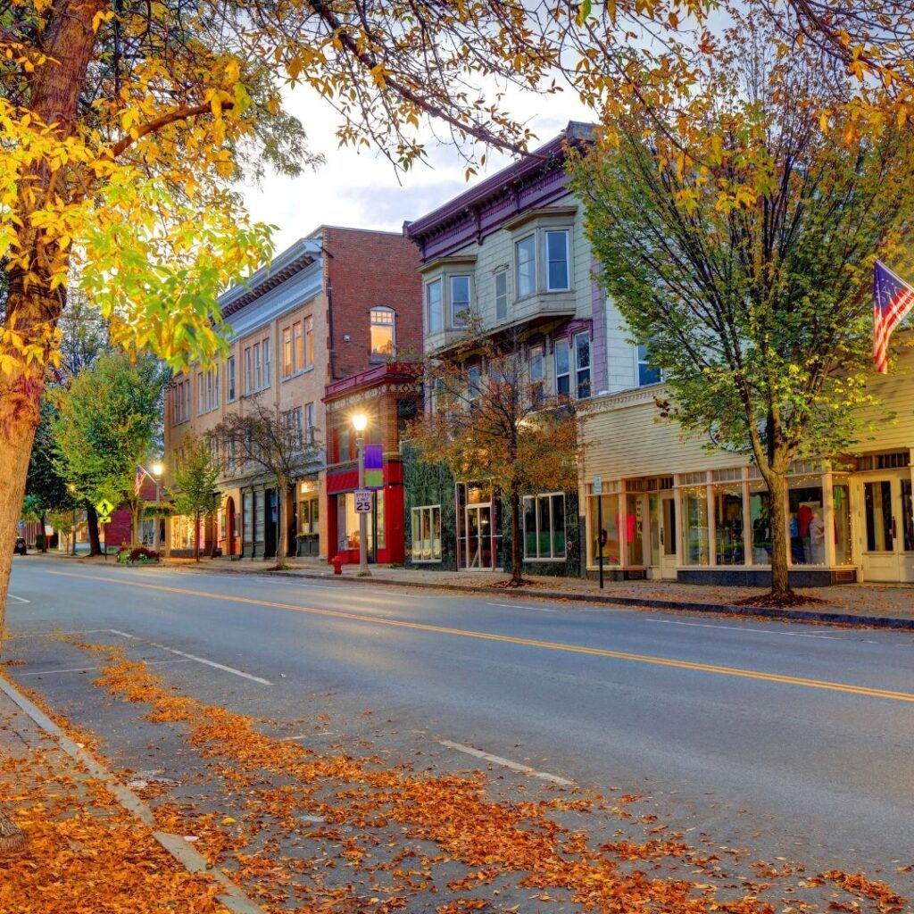 A gorgeous street in Chelsea with picturesque store buildings of different colors.
