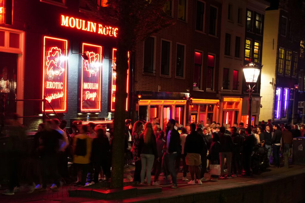 Red Light District (De Wallen) at Night, Photo by Gio on Unsplash.