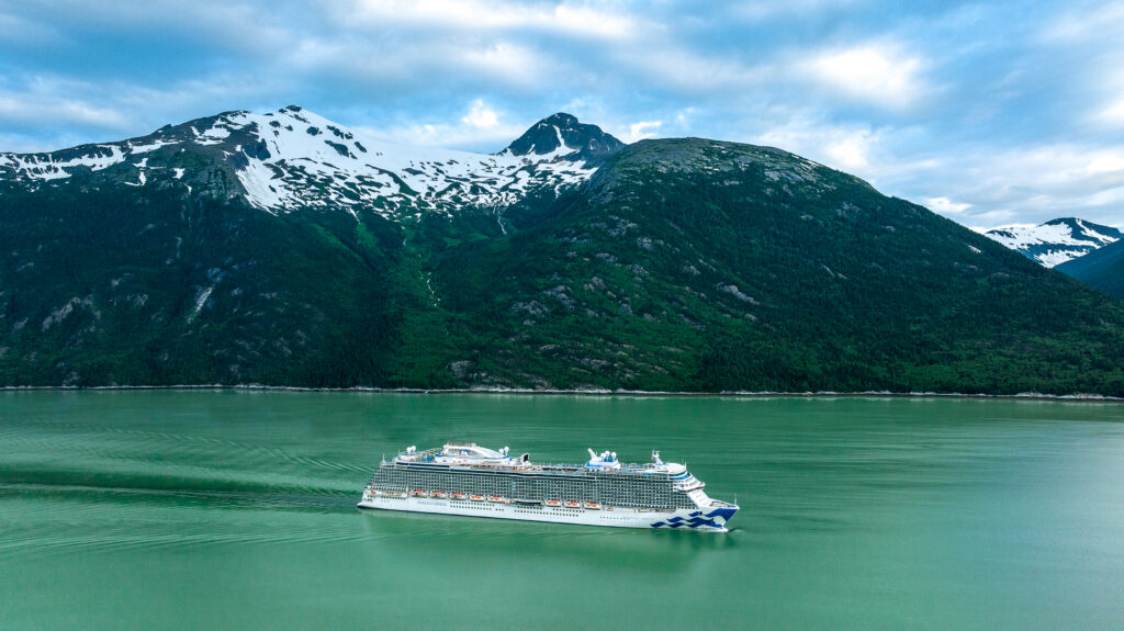 Alaska cruise ship scenic cruising with mountains and fjord views. Photo rights to Princess.