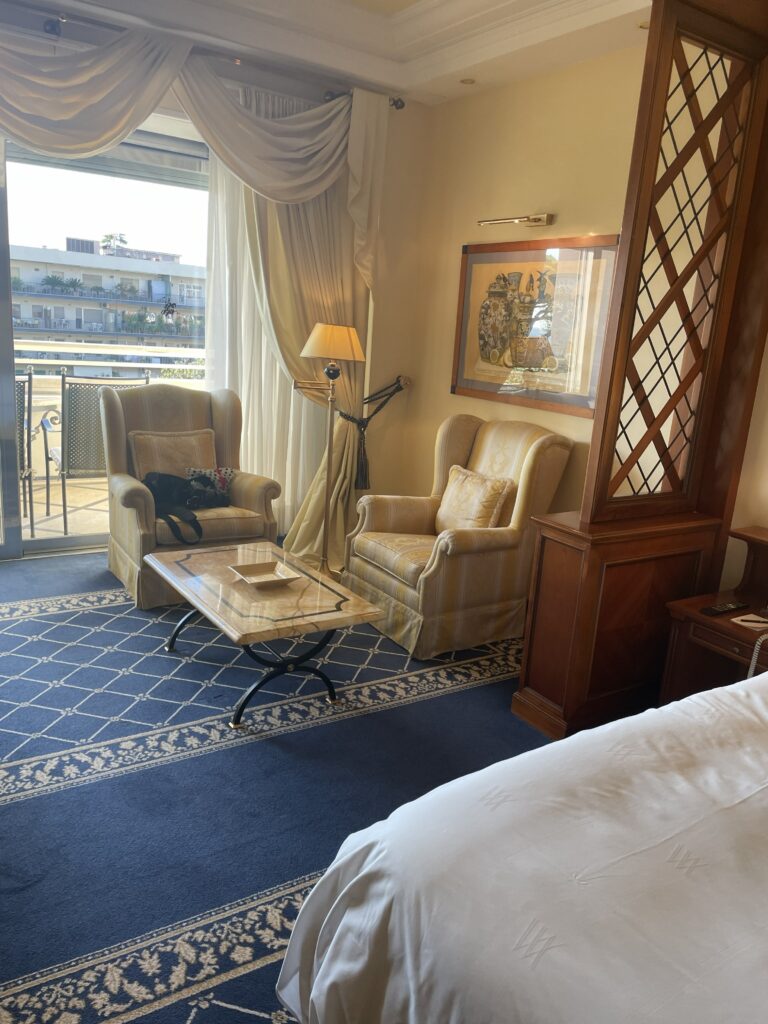 Waldorf guest room sitting area: "Waldorf Astoria Rome guest room sitting area balcony"
