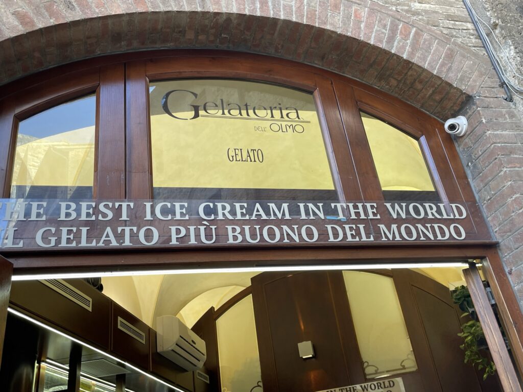 Gelateria dell'Olmo sign: "Gelateria dell Olmo San Gimignano best gelato in the world sign"
