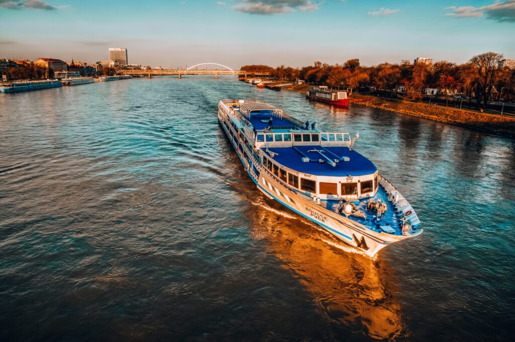 European river cruise on the Rhine with medieval castles and vineyard covered hillsides along the river