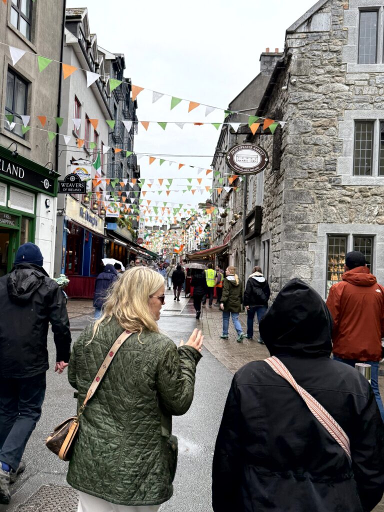 Small group of travelers exploring Galway on a small tour — travel in your 50s and 60s