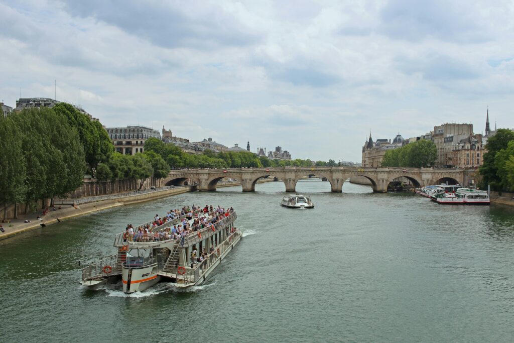 Seine River cruise itinerary stop at Giverny featuring Monet's famous water lily garden and Japanese bridge