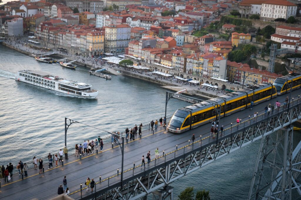 River Cruise ship on the Douro River with UNESCO heritage terraced vineyards covering the hillsides in Portugal