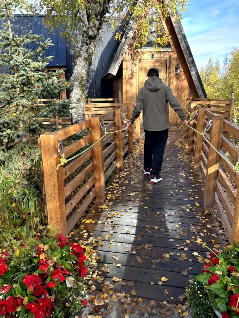 Aaron walking into the Denali viewing cabin on the Alaska cruisetour lodge property