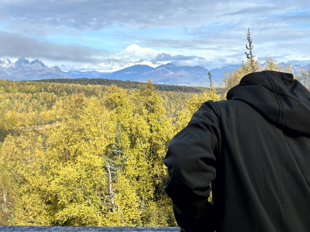Aaron viewing Denali from the cabin deck