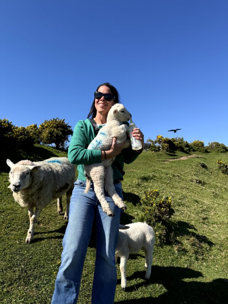 Kris Redinbo holding lamb Slea Head Dingle Peninsula Ireland