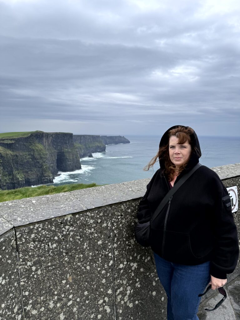 Karla in the rain at the Cliffs of Moher, Ireland, on her April trip